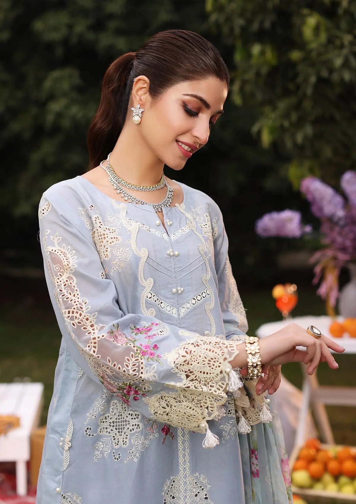 closeup image of FIRUZE Embroidered Organza Neckline from KAHF's Festive Lawn collection 2024.